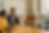 People brainstorming in a meeting with a robot.