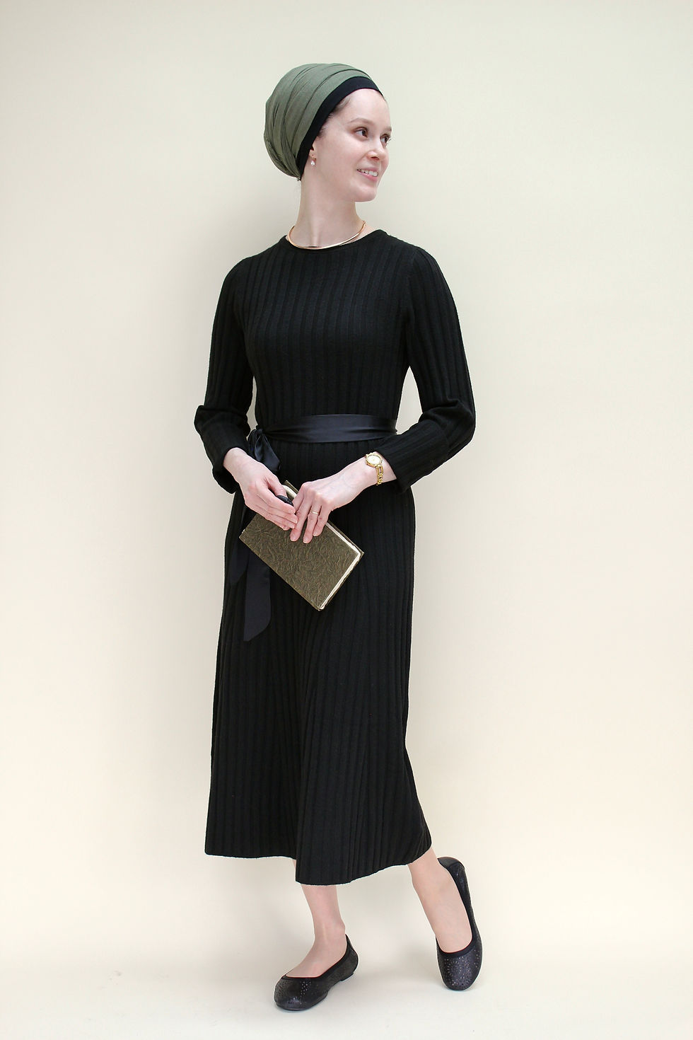 Woman in headscarf and black modest dress