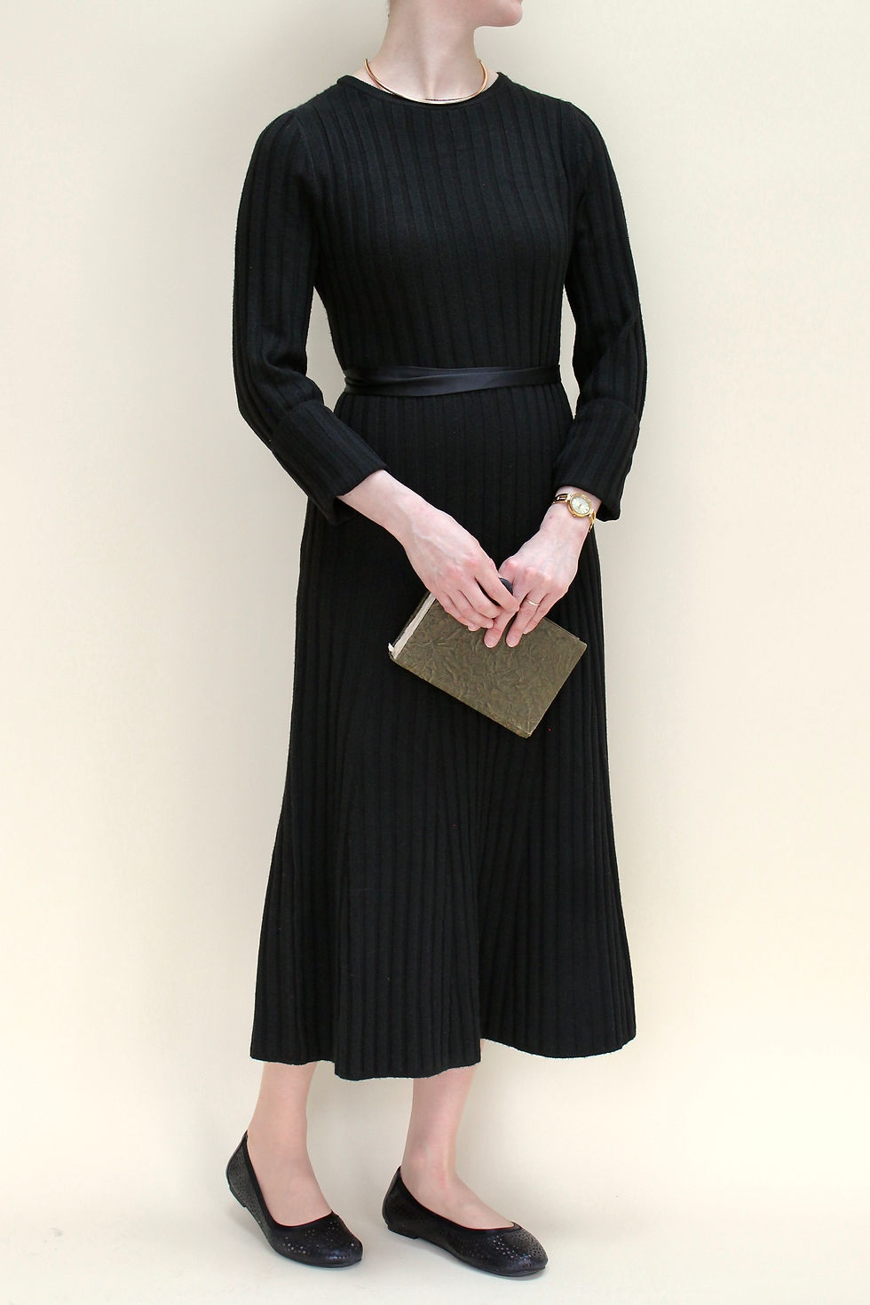 Woman in black midi sweater dress and Vionic flats