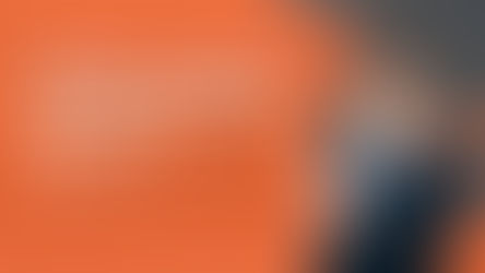 Smiling man in suit points at text: "General Liability vs. Professional Liability. Which Does Your Connecticut Business Need?" Orange-grey design.