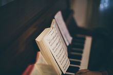 Sheet Music Over Piano