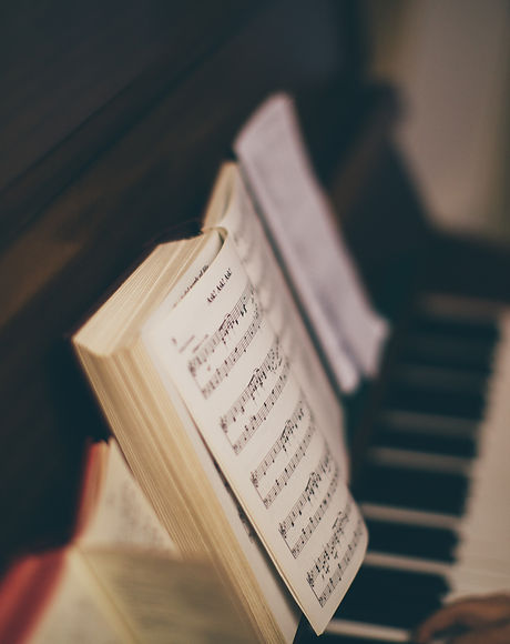Sheet Music Over Piano