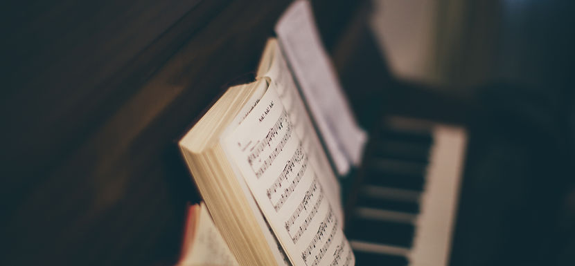 Sheet Music Over Piano