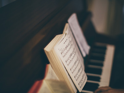 Sheet Music Over Piano