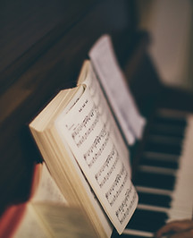 Sheet Music Over Piano