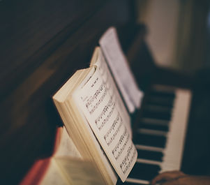 Sheet Music Over Piano