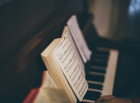 Sheet Music Over Piano