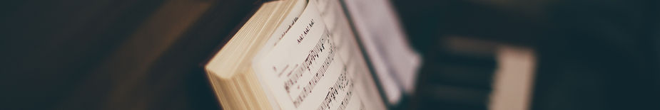 Sheet Music Over Piano