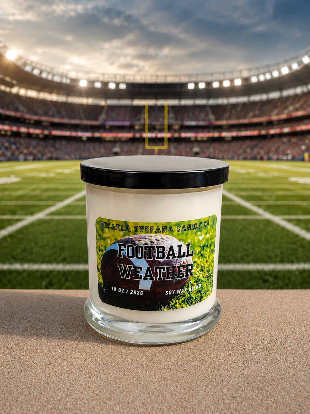 Football Weather candle with a flat black lid.