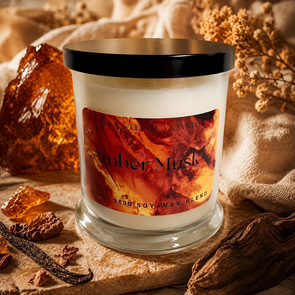 Thumbnail: Amber Musk candle with a black lid.