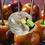 Thumbnail: 22oz. Caramel Applelicious Clear Glass Pumpkin Candle video with a backround of caramel apples