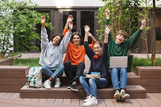 group-joyful-students-sitting-happily-raising-their-hands-up-courtyard-university.jpg