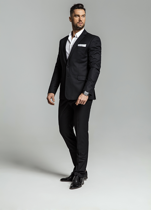 Portrait of handsome man in black suit_edited.png