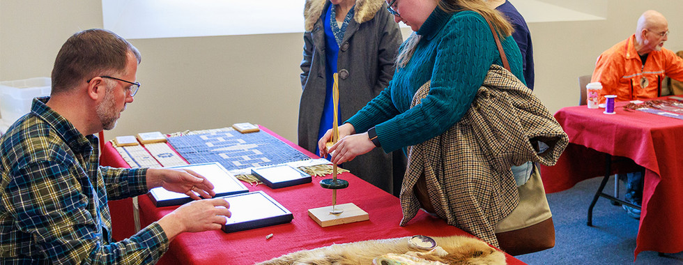 woman using a pump drill at educational table