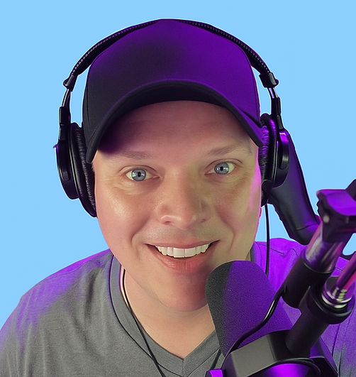 Smiling D.B. Nyce wearing a black cap and headphones.