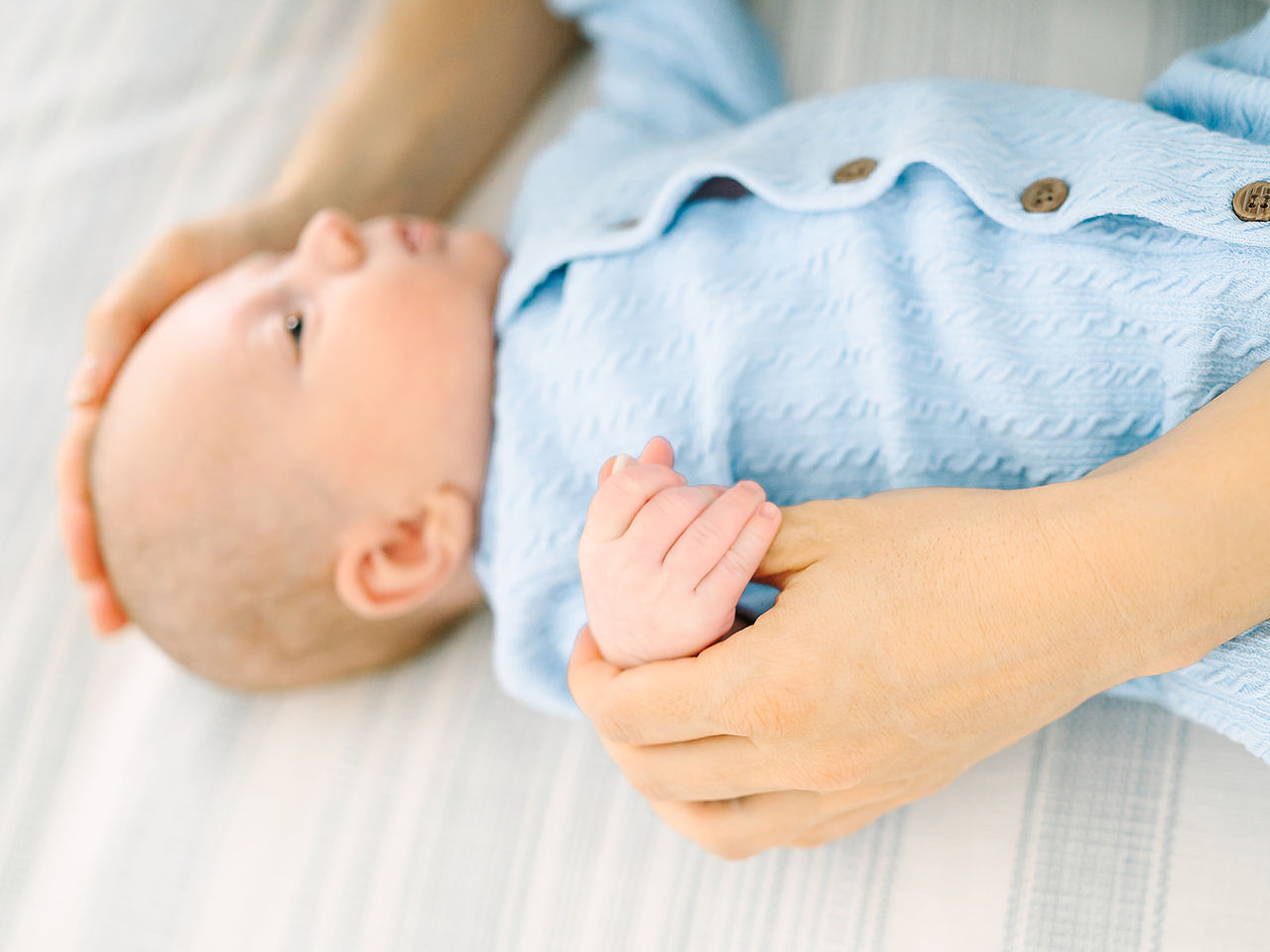 in-home newborn session with mom, baby and dogs in ponte vedra florida