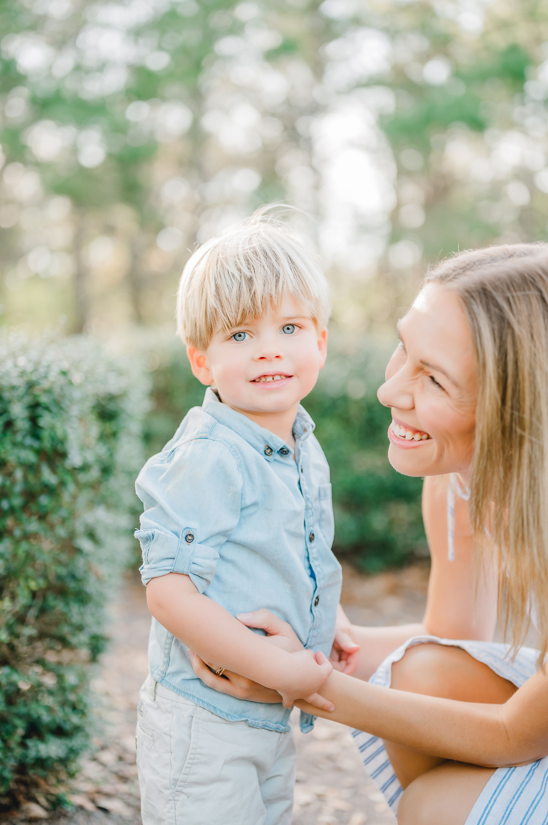 mother and son at a family photo session in ponte vedra at a wooded maze