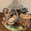 Thumbnail: Ceramic sculpture: Musicians playing drums under a hut