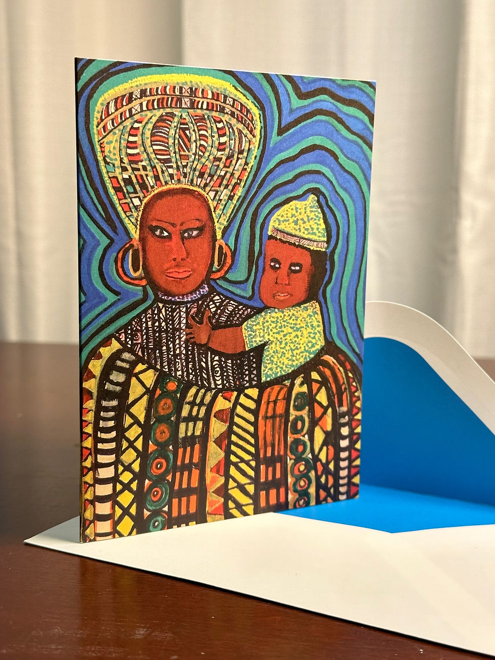 Vibrant greeting card: Mother and child in colorful, traditional African attire