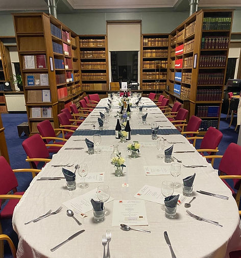 a table set for a Burns Dinner within a library