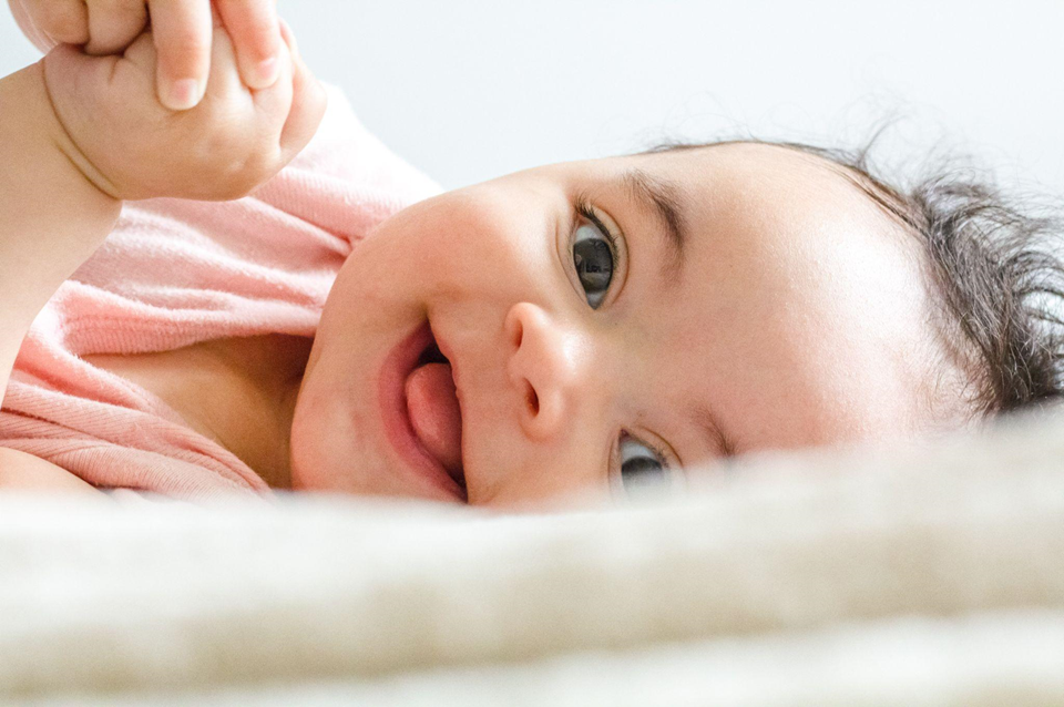 Photo of a cute baby smiling.