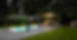A long swim spa with an electric covana cover lifted.