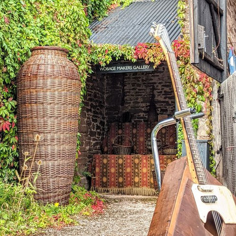 Wobage Farm Craft Workshops Maker Gallery Herefordshire art artist Mick Sheila Casson pottery potter clay woodwork willow barn exhibition basket willow weaving woven guitar