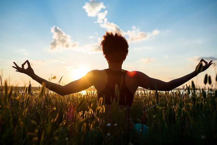 silhouette-sportive-girl-practicing-yoga-field-sunrise.jpg