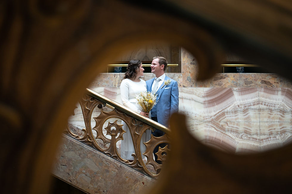 Wedding photo on stairs of Wandsworth Town Hall