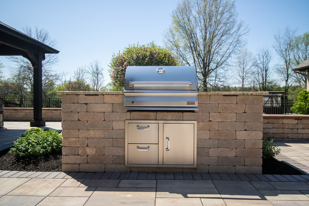 Outdoor stone kitchen with a built-in grill in Galena, OH