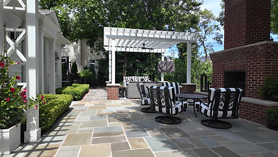 Outdoor patio in Upper Arlington with pergola and fireplace