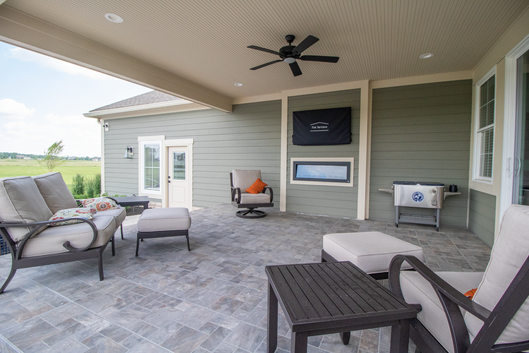 Modern covered patio with fireplace and TV in Sunbury, OH
