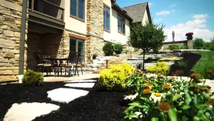 Natural stone patio with flagstone path and garden.