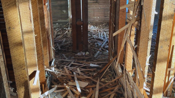 Farmhouse renovation in Willard, Ohio showing updated electrical work and framing — part of full structural rebuild by Pegasus Builders.