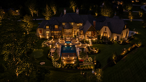 Aerial view of estate with luxury landscape lighting
