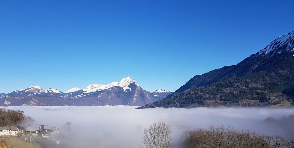 Blue sky with snow covered mountains