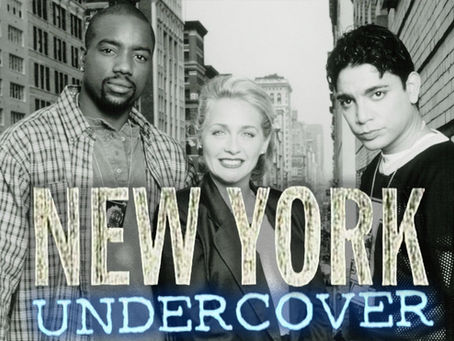 Cast of New York Undercover TV show – Malik Yoba, Patti D’Arbanville, and Michael DeLorenzo standing in New York City street from the 1990s.