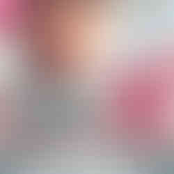 Promo image of lead actress in "High Potential" wearing pink cleaning gloves and holding crime scene tape across her face.