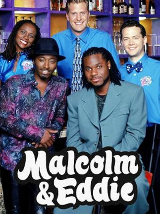 Group photo of the Malcolm & Eddie cast, with Malcolm-Jamal Warner sitting front and center in a green suit alongside co-star Eddie Griffin
