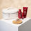 Miniaturbild: White bag and beauty products, WELLA Professionals Ultimate Repair Geschenkset on white surface. 