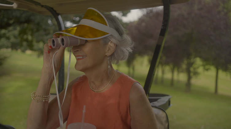 Jane in golf car.png