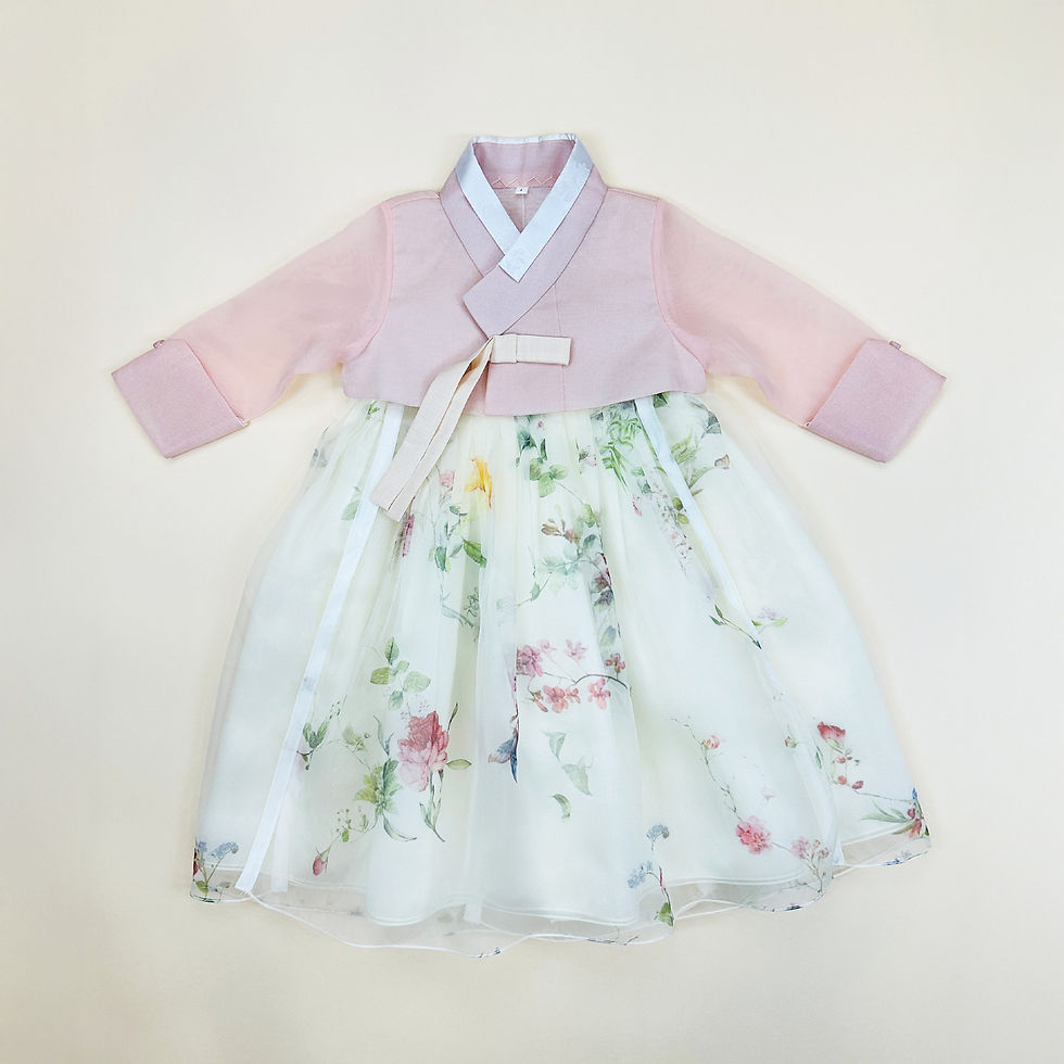 Baby girl hanbok with soft pink jeogori and ivory chima decorated with colorful wildflower print for first birthday celebrati
