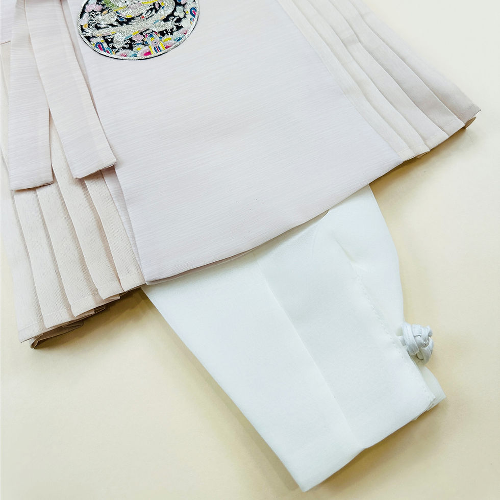 Thumbnail: Baby boy dohl hanbok with pleated light beige top, embroidered crest, white jeogori sleeves, and navy pants
