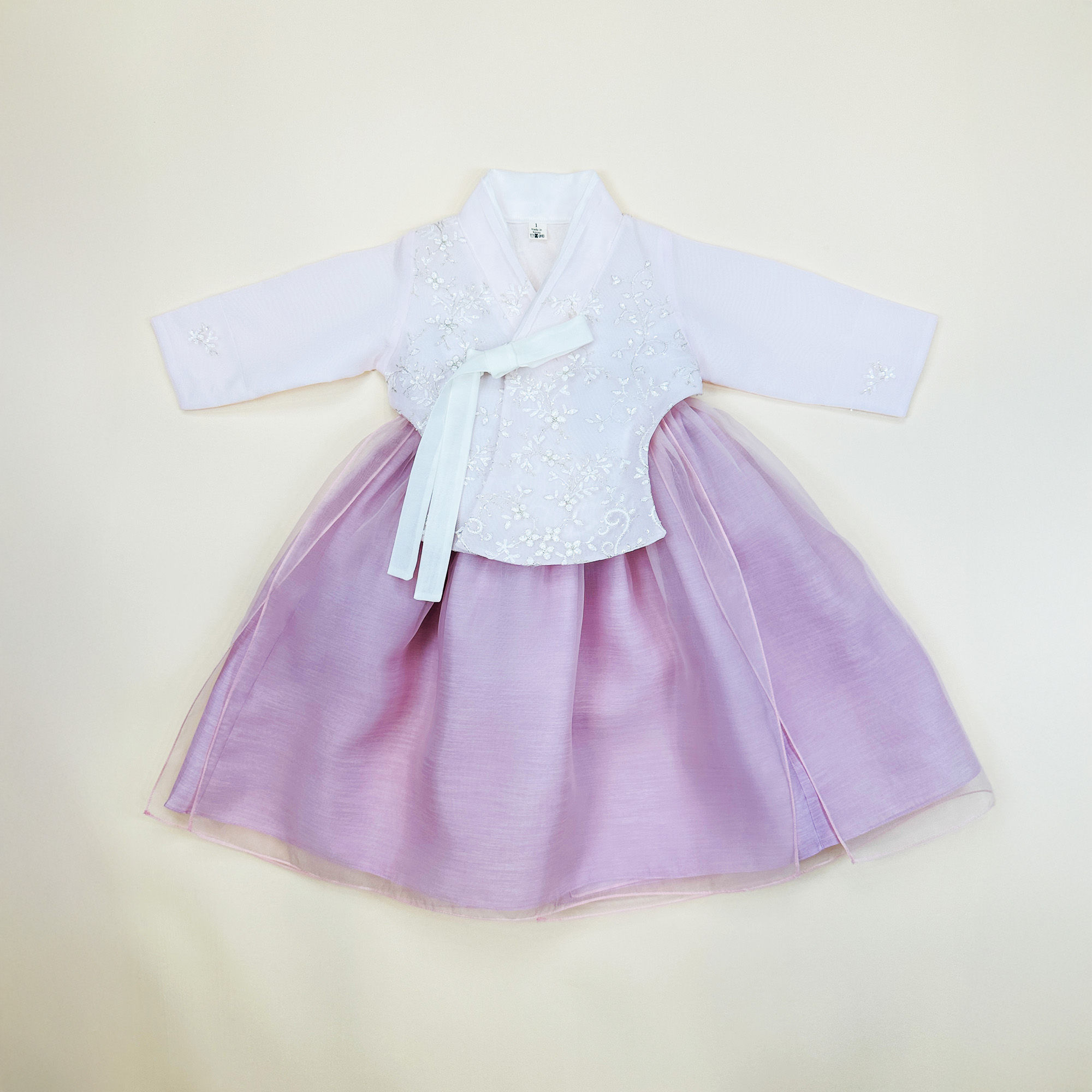 Baby girl hanbok with light pink floral embroidered jeogori and deep rose pink skirt adorned with subtle sparkles