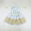 Thumbnail: Baby girl hanbok with white jeogori featuring gold foil sleeve pattern and light peach chima, accented with a round embroider