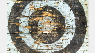 An archery board showing inaccurate achievements by an archer