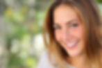 Happy, smiling female with Spring background