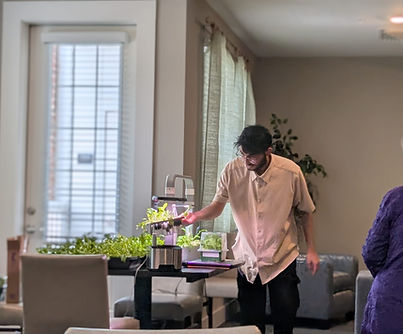 Living Food Expert Demonstrating How to Grow Food Indoors Using Hydroponics.jpeg