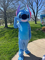 person in a full body stitch costume raising his right hand