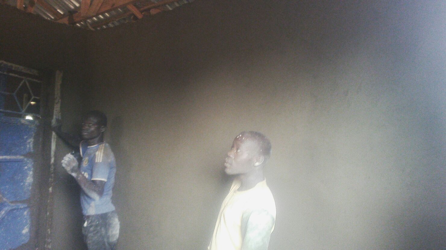 Worker(s) reviewing wall plaster